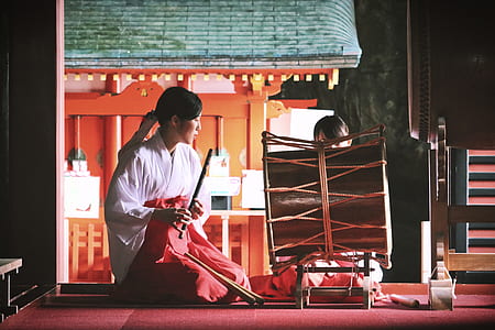 woman in white top playing percussion drum thumbnail