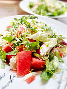 vegetable and fruit salad on white platter thumbnail