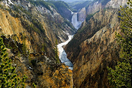 body of water in between cliff at daytime thumbnail