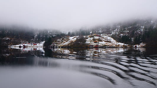 body of water and rock formations thumbnail