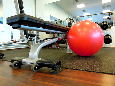 red stability ball beside bench press thumbnail
