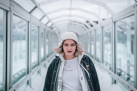 woman standing on glass hallway thumbnail