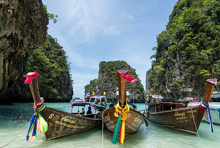 three boats on body of water thumbnail