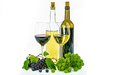 two clear glass bottles and wine glasses thumbnail