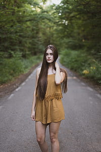woman standing on concrete road thumbnail