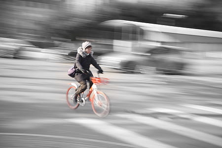 timelapsed photography of woman ridding bike thumbnail