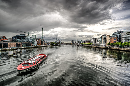red and white passenger boat on body of water thumbnail