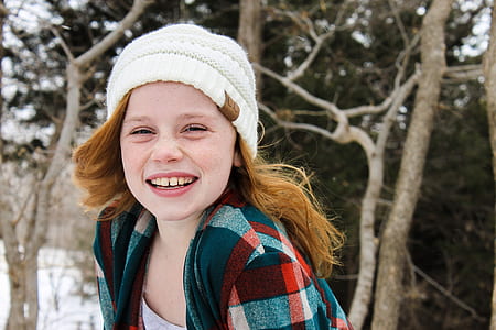 girl wearing white knit hat thumbnail