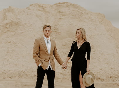 man and woman holding hands thumbnail