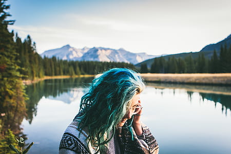 woman standing near lake thumbnail