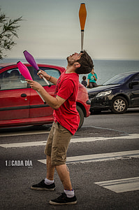 man holding plastic tools on street thumbnail