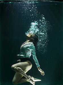 photography of woman under water thumbnail