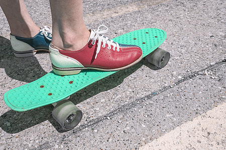 person riding green penny board thumbnail