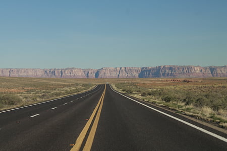 asphalt road between grass field thumbnail