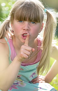 girl put her hand on lips thumbnail