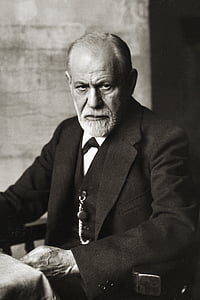 grayscale photo of man wearing notched lapel suit jacket thumbnail