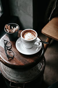 white coffee mug on white saucer thumbnail