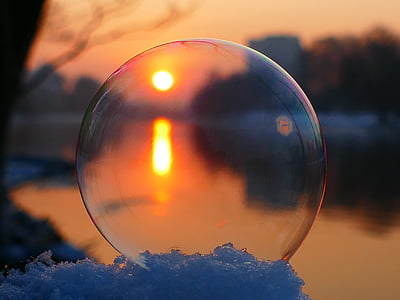 bubble on snow beside body of water thumbnail