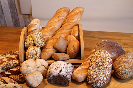 assorted baked breads on table thumbnail