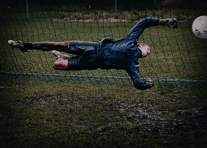 goal keeper trying to catch ball thumbnail
