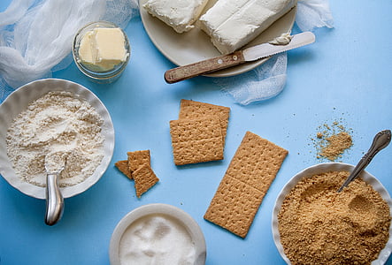 photo of bowl filled with crushed grahams near bowl filled with flours thumbnail