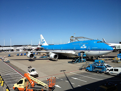 blue and white KLM airliner in airport thumbnail