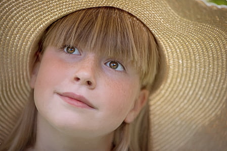 girl wearing brown sunhat thumbnail
