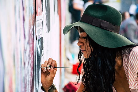 Woman Painting on a Wall thumbnail