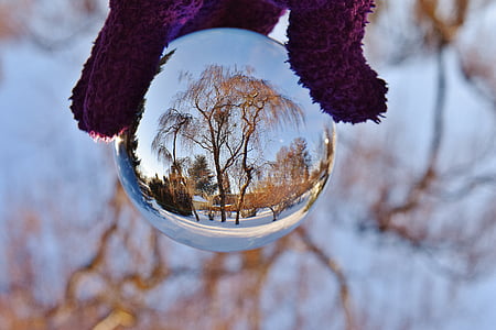 person holding ball mirror thumbnail