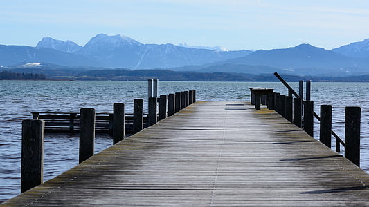 sea dock near mountain range thumbnail