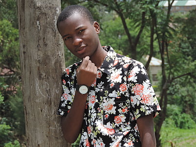 man leaning on tree thumbnail