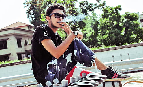 man sitting on table beside plate thumbnail