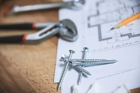 Close up screws and other tools with plans for the apartment thumbnail