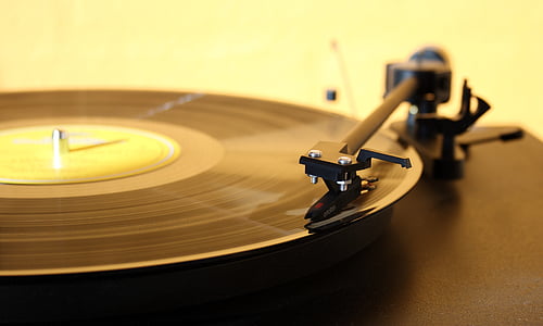 focus photography of black vinyl record player thumbnail