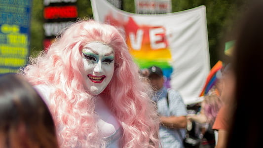 Woman Wearing Pink Wig and White Makeup thumbnail