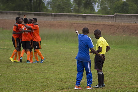 group of men playing soccer thumbnail