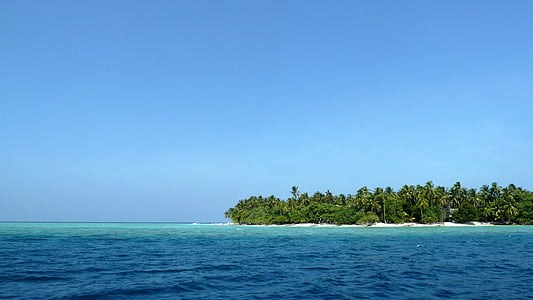 landscape photography of island beside body of water thumbnail