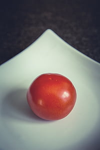 red tomato on white ceramic plate thumbnail