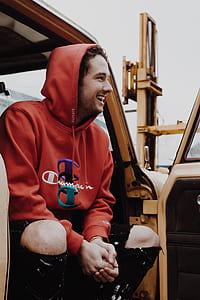 man in red Champion pullover hoodie thumbnail
