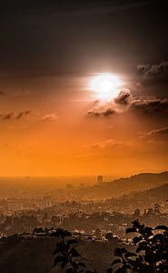 hill view of the city during day thumbnail