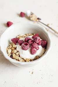 cereal with cream and red raspberries thumbnail