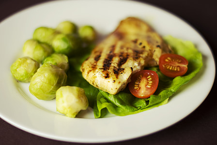cooked food and vegetables on ceramic plate thumbnail