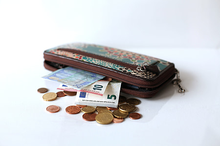 gold and silver coin and banknote on wallet thumbnail
