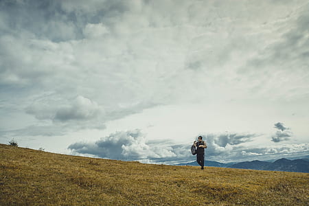 man walking on mountain thumbnail
