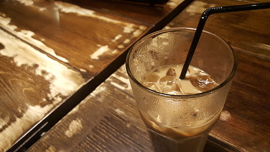 clear drinking glass with brown liquid thumbnail