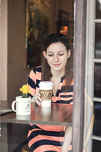 woman holding coffee disposable cup thumbnail
