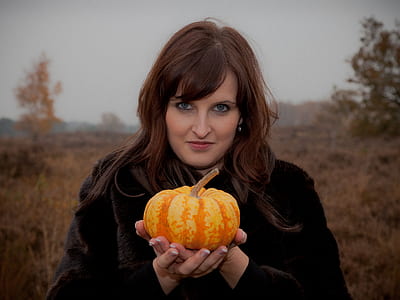 woman holding orange squash thumbnail