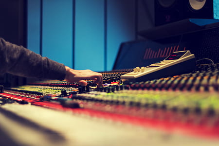 person in brown long-sleeved top playing audio mixer thumbnail