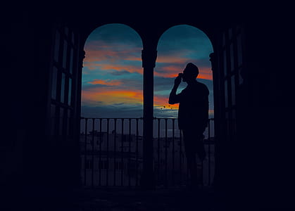 silhouette photo of person near arc thumbnail