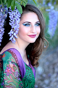 woman leaning on purple flowers thumbnail
